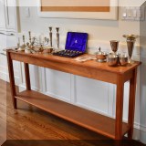 F15. Cherry console table with shelf. 30”h x 60”w x 13”d 